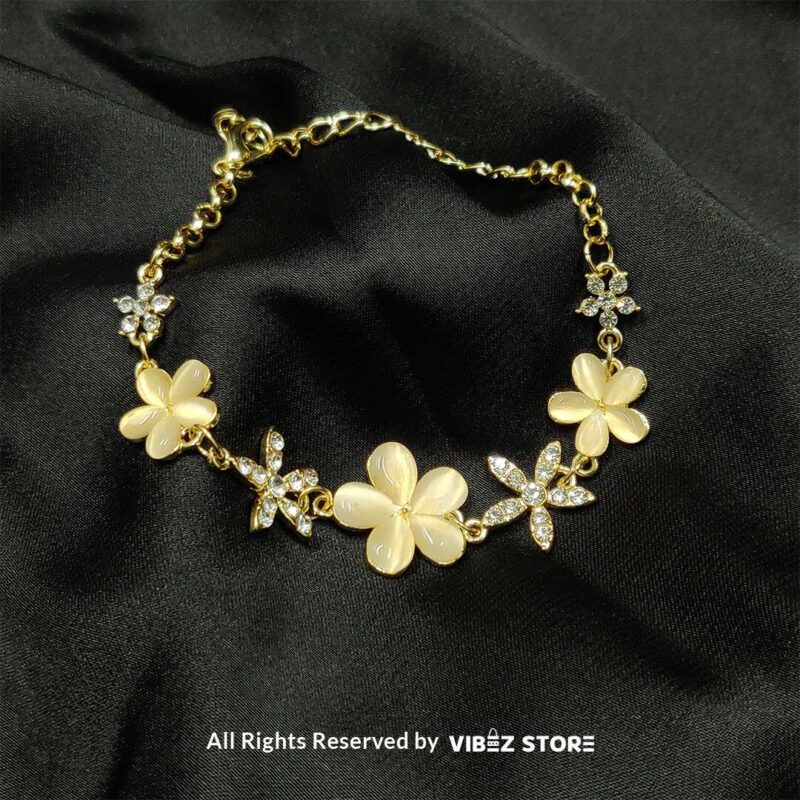 Ivory Floral Charm Bracelet with Crystals – Elegant Golden Chain 2 Ivory Floral Charm Bracelet with delicate crystals set on a golden chain from VibezStore