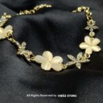 Ivory Floral Charm Bracelet with Crystals – Elegant Golden Chain