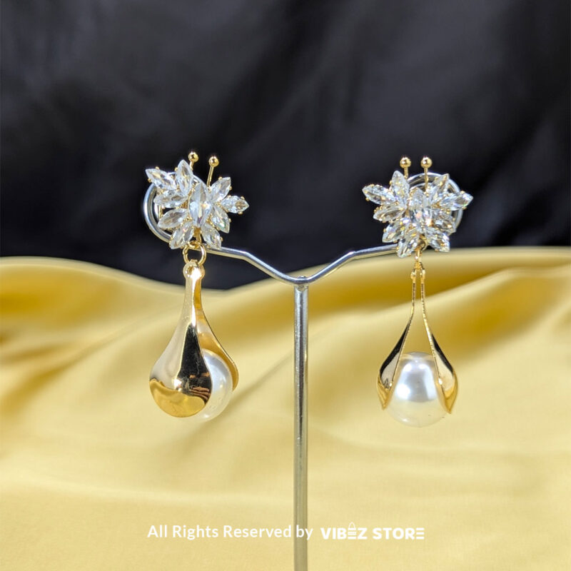 Sparkling Floral Pearl Drop Earrings 1 Crystal floral earrings with teardrop pearl accents, displayed in gold and silver variations by Vibez Store.