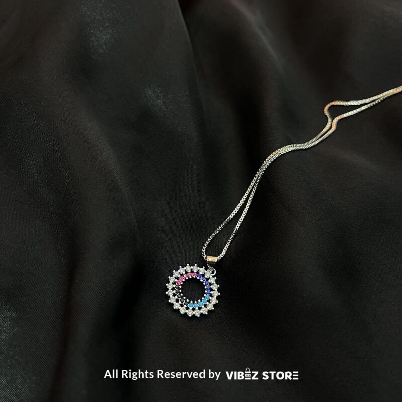 Circular Multicolor Crystal Locket 2 Circular Multicolor Crystal Locket with silver and gold-tone options on a black background