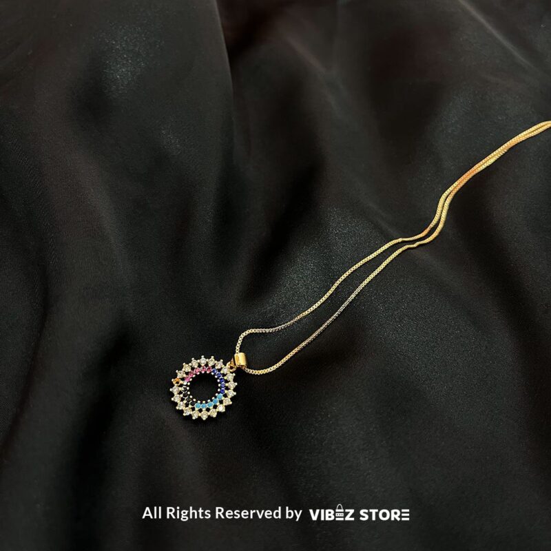 Circular Multicolor Crystal Locket 3 Circular Multicolor Crystal Locket with silver and gold-tone options on a black background