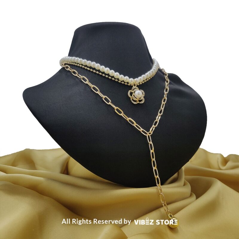 Pearl and Chain Layered Necklace with Flower Pendant 1 Pearl and gold chain layered necklace with flower pendant displayed on black bust