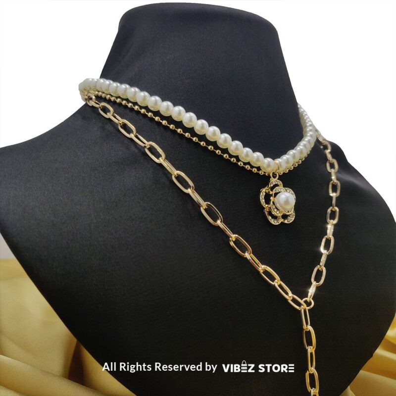 Pearl and Chain Layered Necklace with Flower Pendant 3 Pearl and gold chain layered necklace with flower pendant displayed on black bust