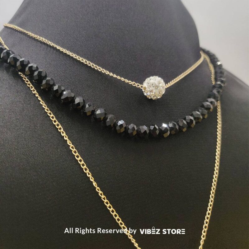 Triple-Layer Beaded and Chain Necklace with Crystal Ball Accent 3 Triple-layer necklace with black beads, gold chains, and crystal ball accent displayed on black bust
