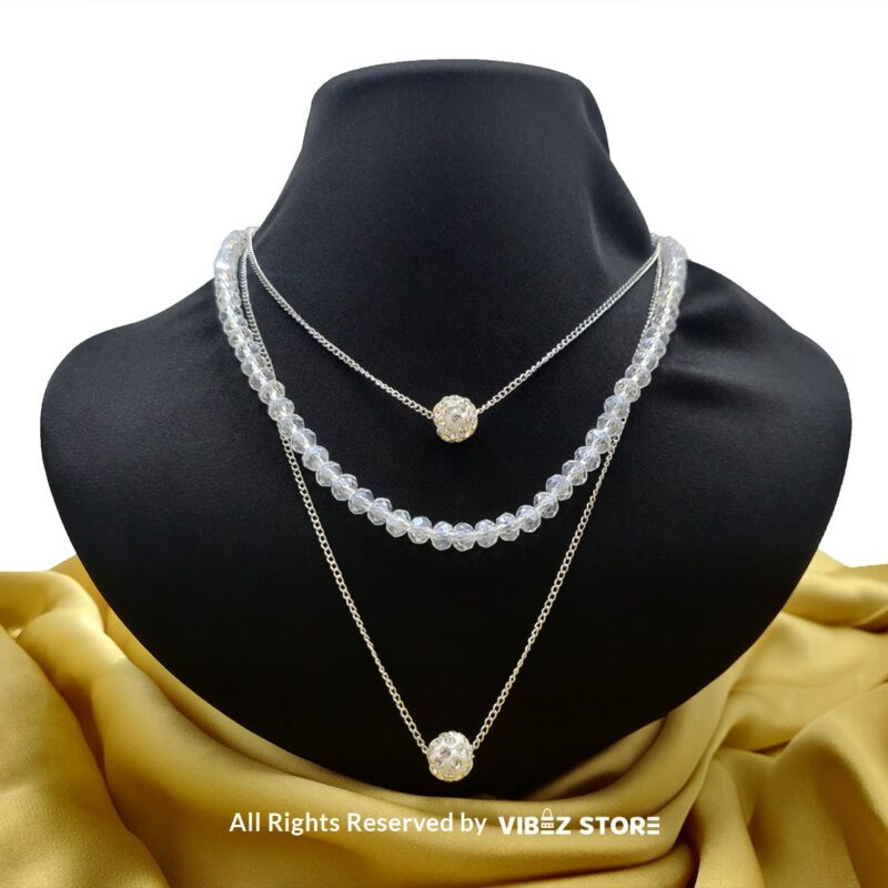 Triple-Layer Beaded and Chain Necklace with Crystal Ball Accent 4 Triple-layer necklace with black beads, gold chains, and crystal ball accent displayed on black bust