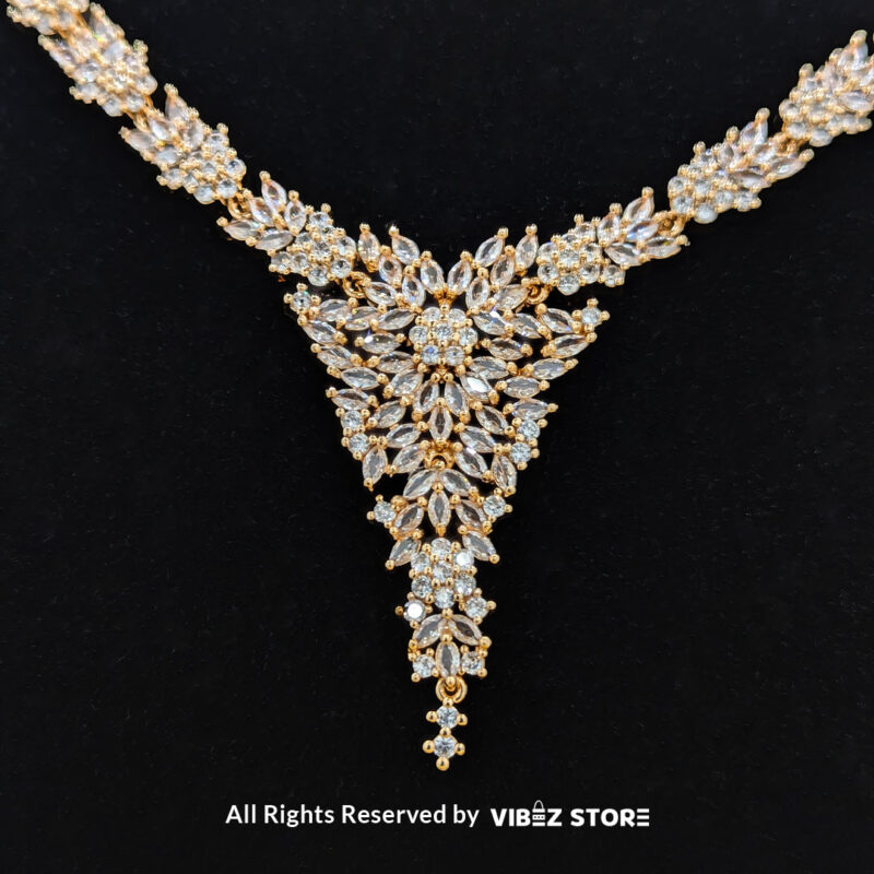 Elegant Floral Crystal Jewelry Set 1 Floral crystal jewelry set with a necklace, earrings, bracelet, and ring, elegantly displayed by Vibez Store.