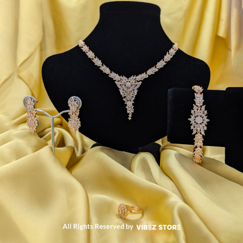 Elegant Floral Crystal Jewelry Set 3 Floral crystal jewelry set with a necklace, earrings, bracelet, and ring, elegantly displayed by Vibez Store.