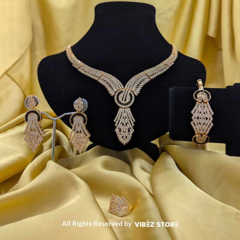 Luxurious Crystal Wings Jewelry Set 3 Crystal wings jewelry set featuring a necklace, earrings, bracelet, and ring, elegantly displayed by Vibez Store.