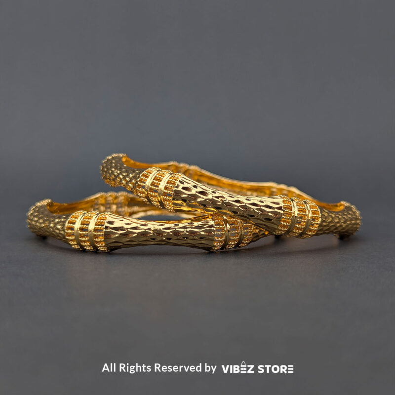 Textured Gold-Tone Twisted Bangle Pair 1 Pair of gold-tone twisted bangles with a textured finish, displayed elegantly by Vibez Store.