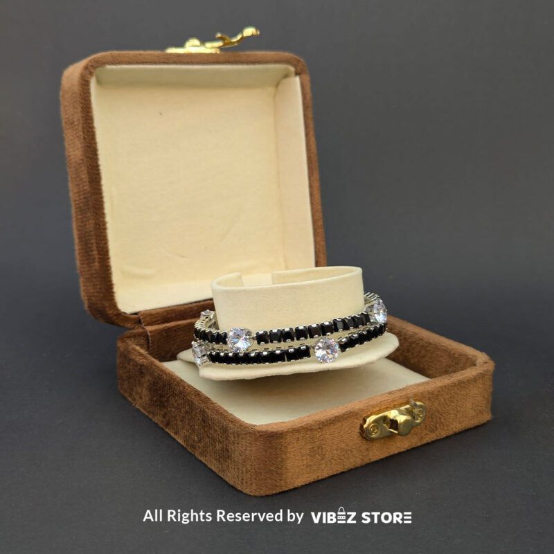Black Crystal Silver Bangles 2 Elegant silver bangles with black square crystals and sparkling round stones.