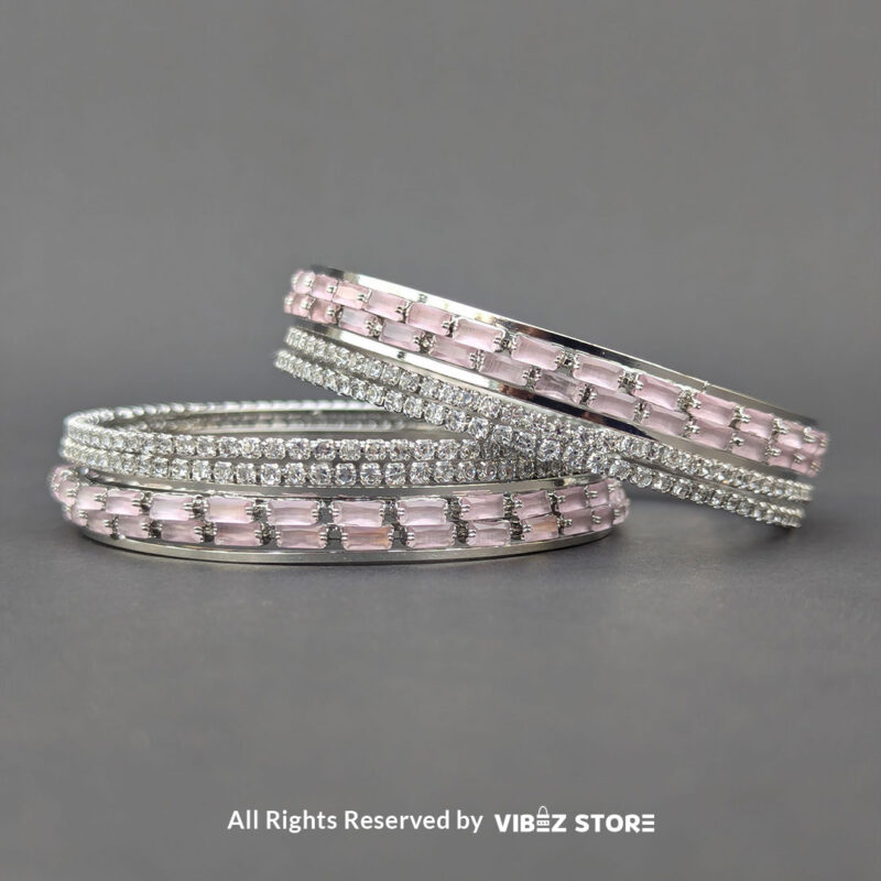 Pink Crystal Silver Bangles Set 1 Silver bangles set with pink rectangular crystals and shimmering white stones.
