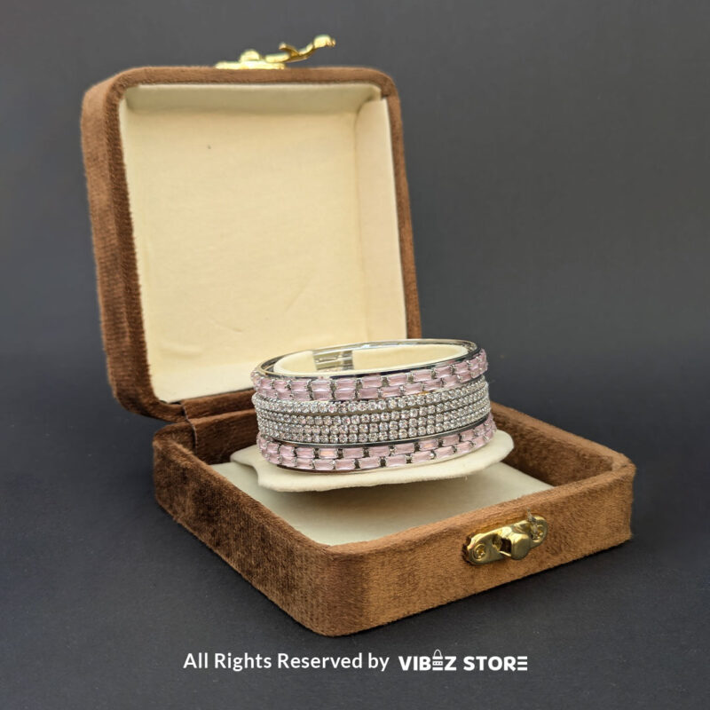 Pink Crystal Silver Bangles Set 2 Silver bangles set with pink rectangular crystals and shimmering white stones.