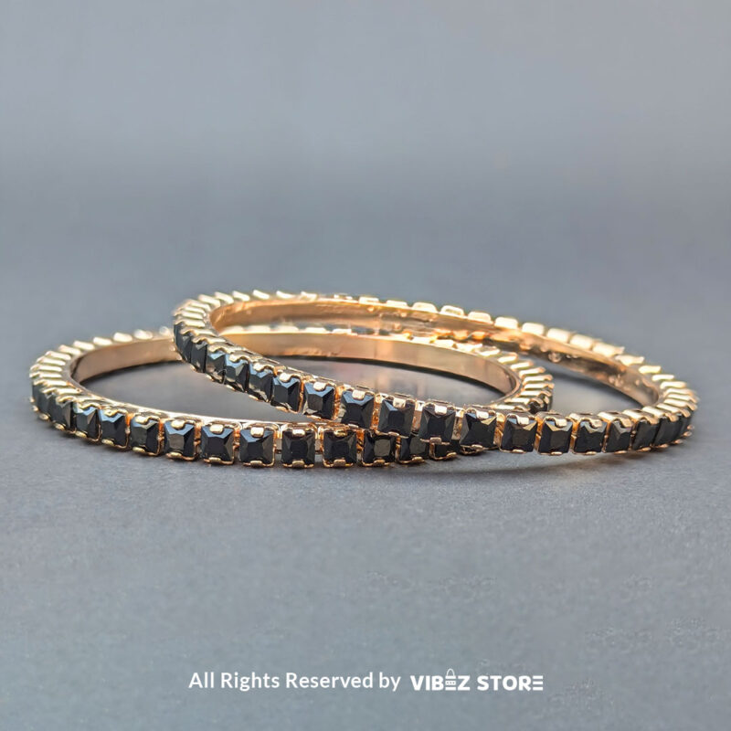 Black Crystal Rose Gold Bangles Set 1 Rose gold bangles set with black crystals for party wear.