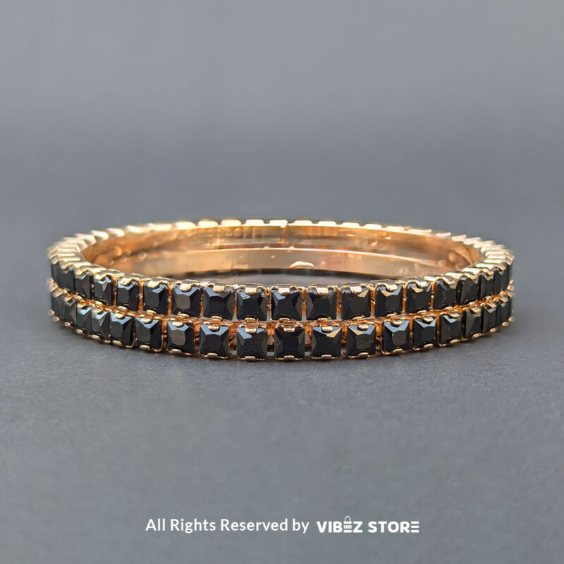 Black Crystal Rose Gold Bangles Set 3 Rose gold bangles set with black crystals for party wear.