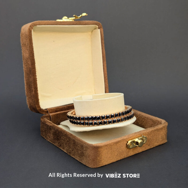 Black Crystal Rose Gold Bangles Set 2 Rose gold bangles set with black crystals for party wear.