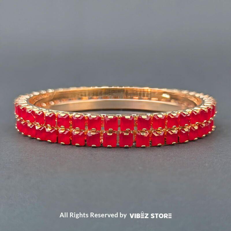 Red Crystal Rose Gold Bangles Set 3 Rose gold bangles set with vibrant red crystals for festive and party wear.