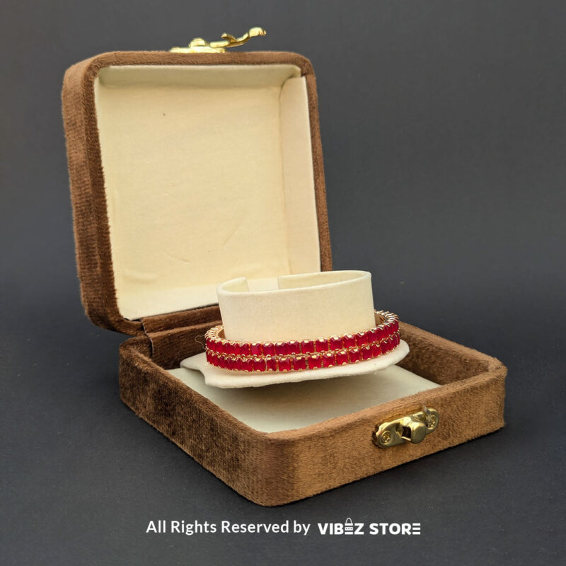 Red Crystal Rose Gold Bangles Set 2 Rose gold bangles set with vibrant red crystals for festive and party wear.