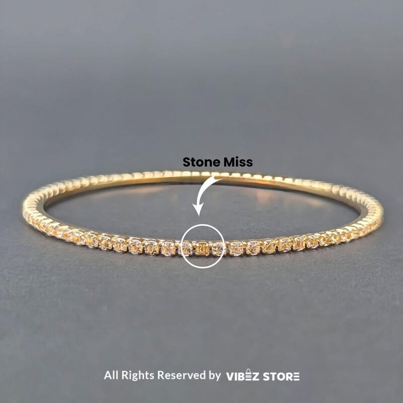 Black & White Crystal Gold Bangles Set 3 Gold bangles set with black stones and white crystals for festive and wedding wear.