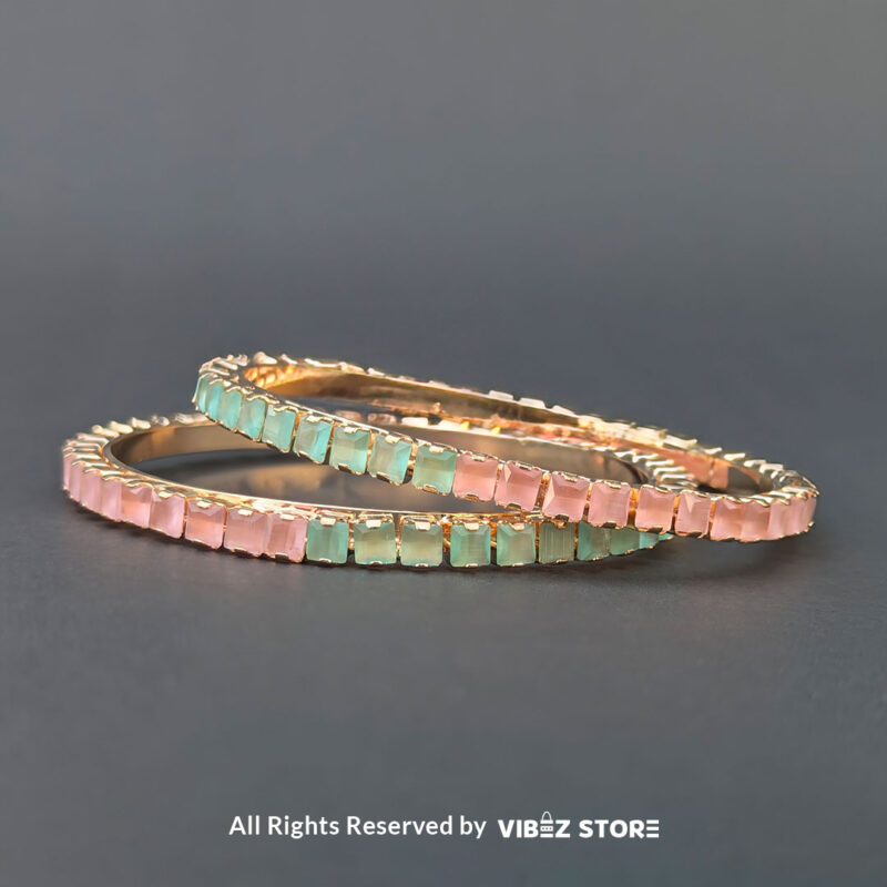 Pastel Pink & Green Gold Bangles Set 1 Pastel pink and green gold bangles set for festive and casual wear.