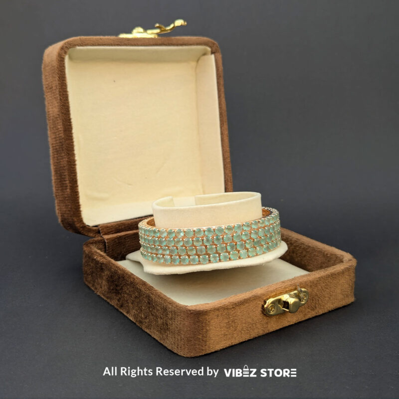 Sea Green Crystal Bangles Set 3 Sea green crystal bangles set on gold-tone base for festive wear.