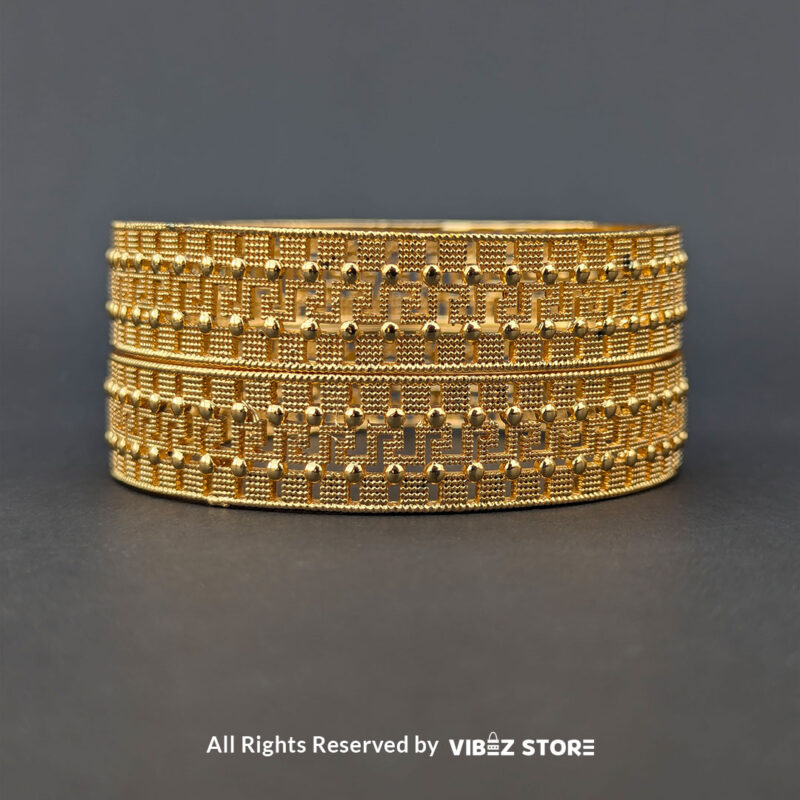 Classic Textured Artificial Gold Bangle 3 Artificial gold bangle with textured design, displayed elegantly by Vibez Store