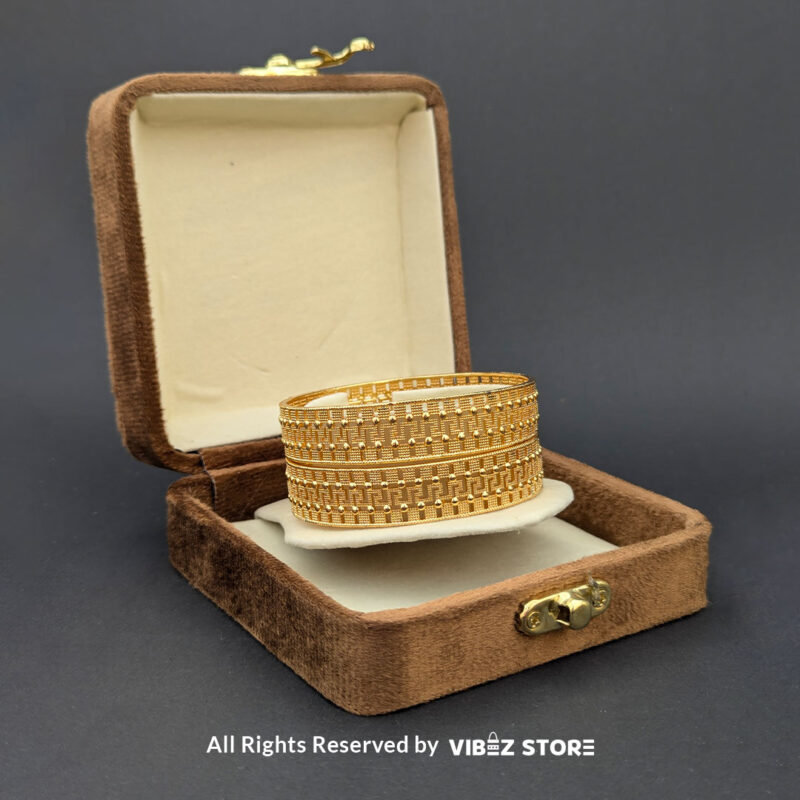 Classic Textured Artificial Gold Bangle 2 Artificial gold bangle with textured design, displayed elegantly by Vibez Store