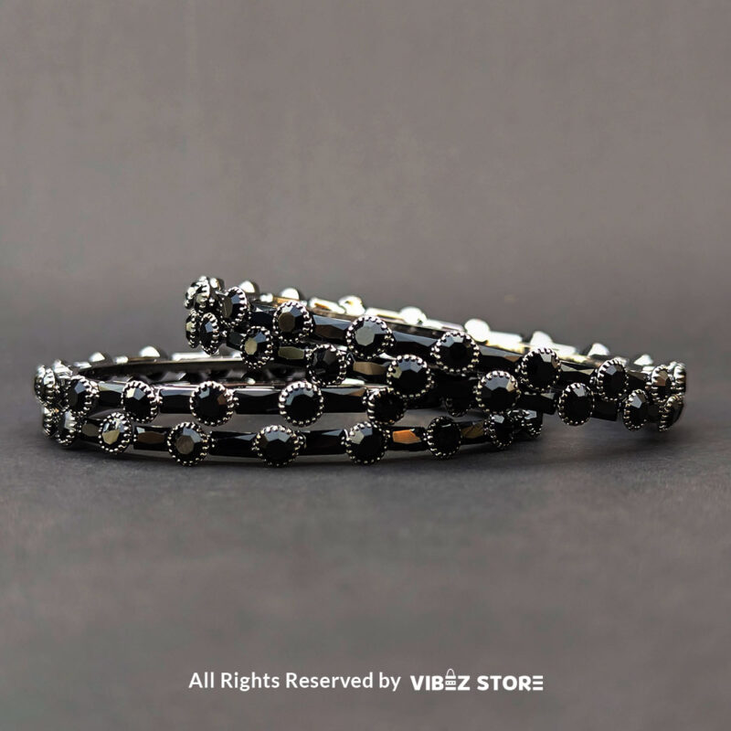 Elegant Black Stone Bangle 1 Black stone bangle with circular stone pattern, displayed elegantly by Vibez Store