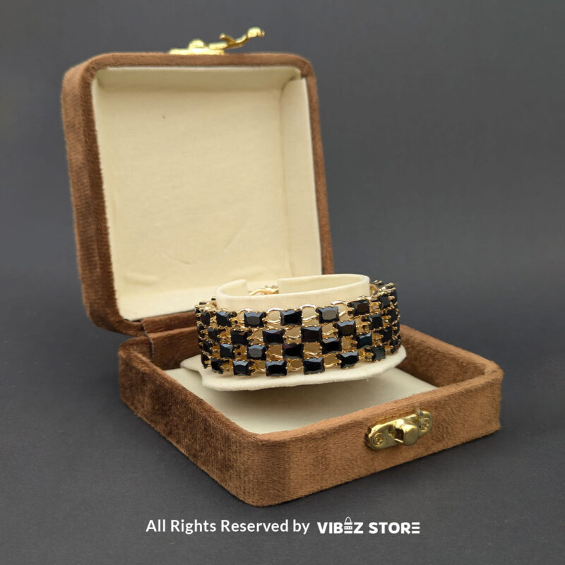 Luxurious Black Stone and Gold Grid Bangle 2 Black stone bangle with gold grid design, displayed elegantly by Vibez Store.
