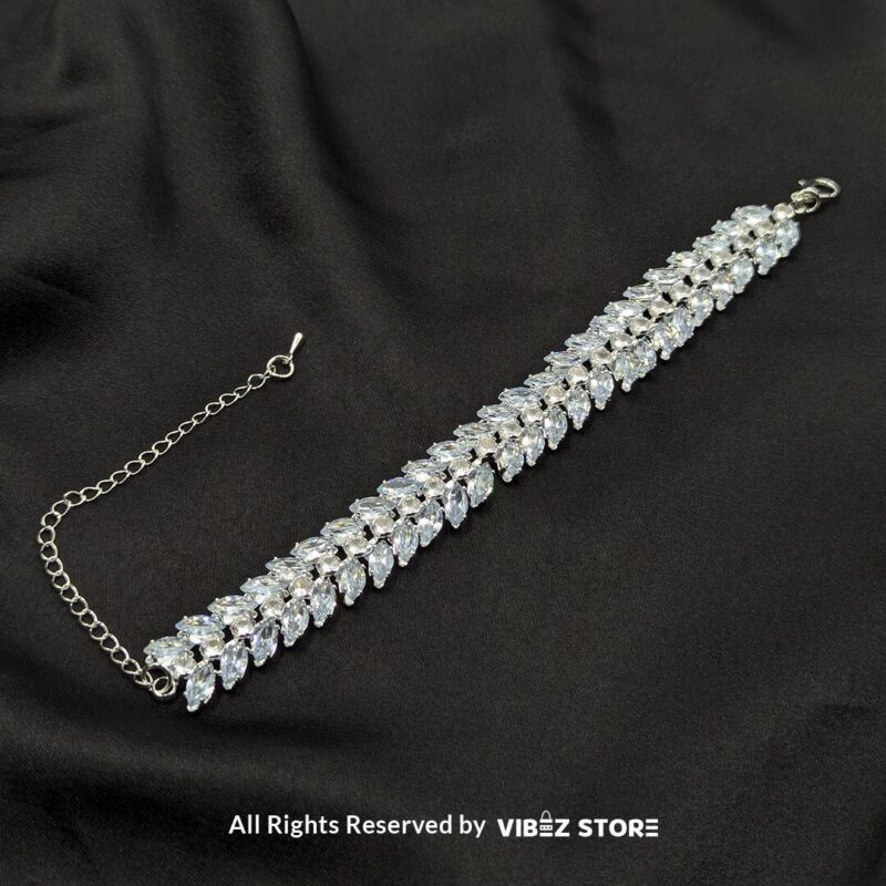 Silver-Tone Crystal Double Row Bracelet 3 Silver-tone double row crystal bracelet with shimmering marquise-cut stones on a black fabric background.