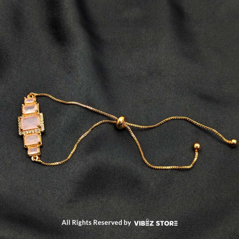 Gold-Tone Pink Stone Adjustable Bracelet 3 Gold-tone adjustable bracelet with pink rectangular stones and crystal accents
