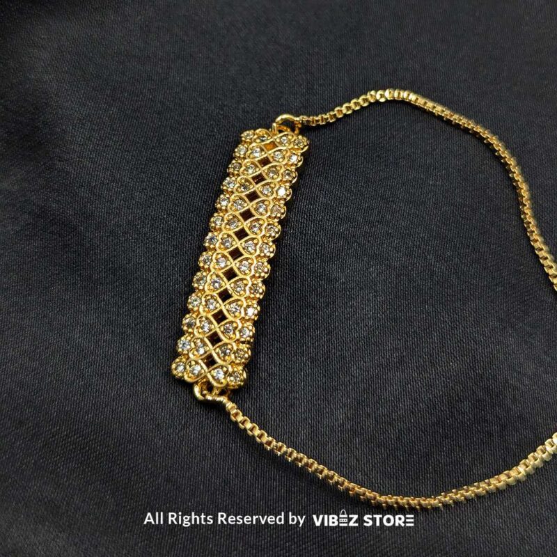 Gold-Tone Adjustable Crystal Mesh Bracelet 1 Gold-tone adjustable bracelet with crystal mesh design on a black background