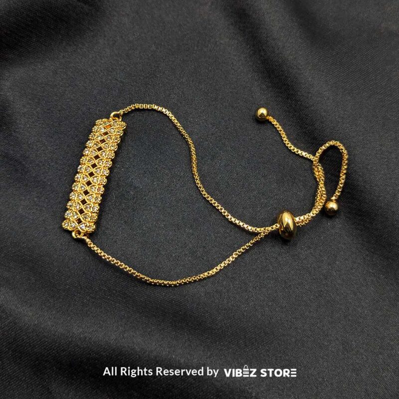 Gold-Tone Adjustable Crystal Mesh Bracelet 3 Gold-tone adjustable bracelet with crystal mesh design on a black background