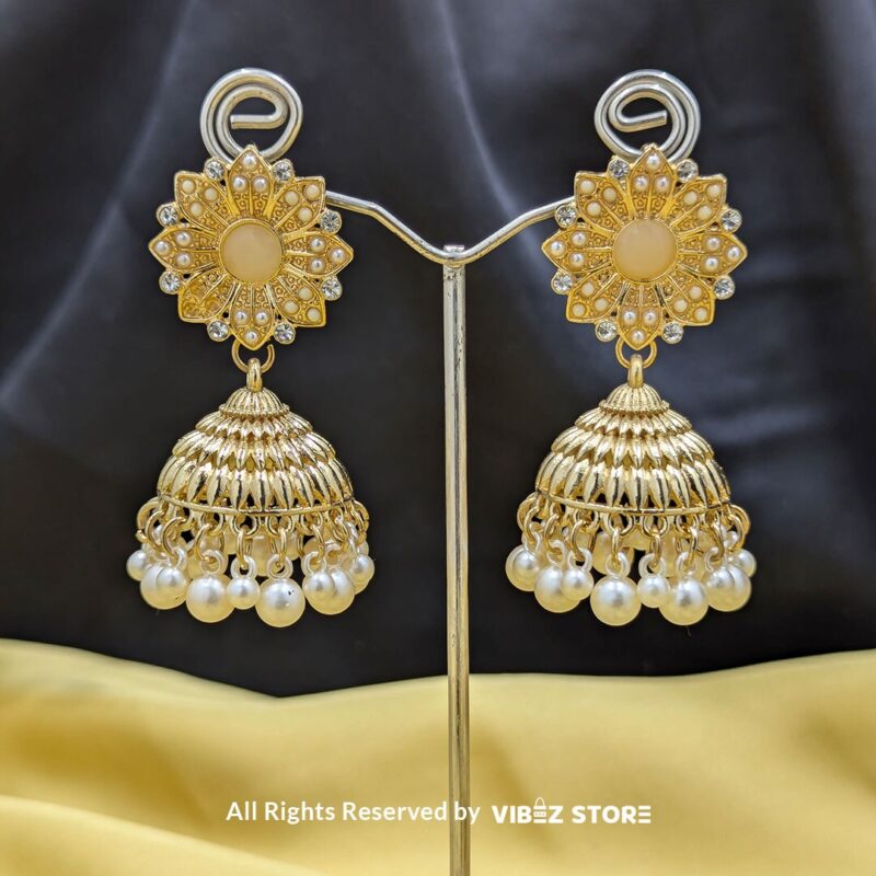 Gold-Tone Jhumka Earrings with Pearl Drops 3 Gold-tone jhumka earrings with floral motifs, pearl drops, and a secure push-back closure, displayed with intricate detailing and a traditional design.