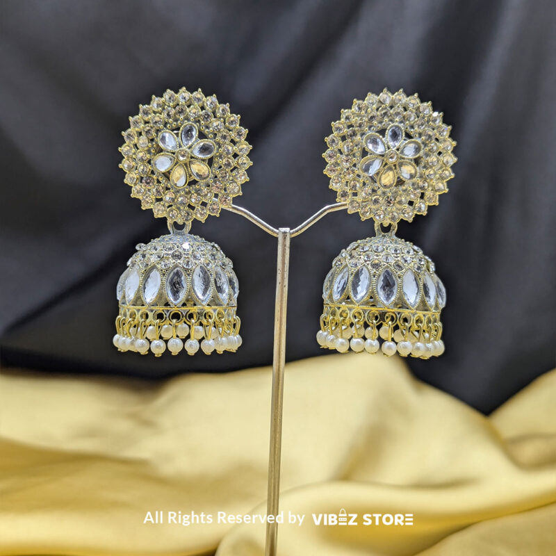 Crystal Kundan Dome Jhumka Earrings 1 Crystal kundan dome jhumka earrings with intricate detailing and pearl drop accents.