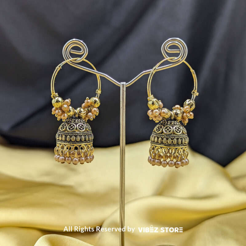 Golden Hoop Jhumka Earrings with Pearl Detailing 1 Golden hoop jhumka earrings with pearl drops and intricate beaded detailing, perfect for ethnic wear.