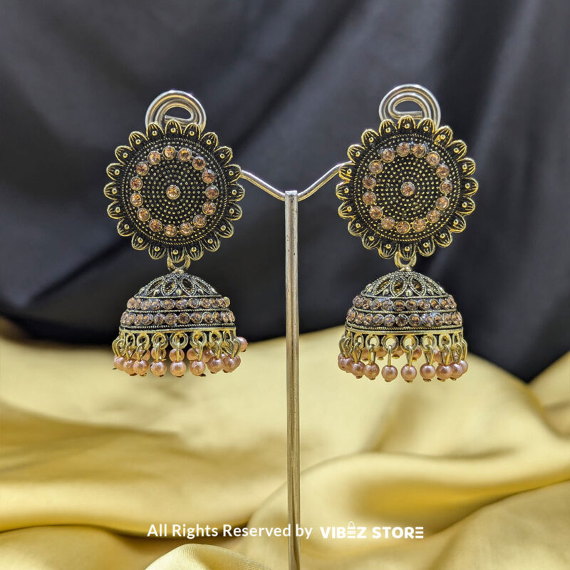Black and Gold Jhumka Earrings with Peach Bead Danglers 1 Black and gold jhumka earrings with intricate detailing and peach bead danglers, perfect for ethnic wear.
