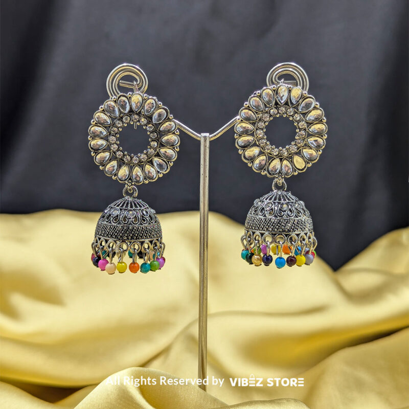 Silver-Plated Kundan Jhumka Earrings 1 Silver-plated kundan jhumka earrings with circular design and vibrant multicolor bead accents, perfect for festive and cultural occasions.