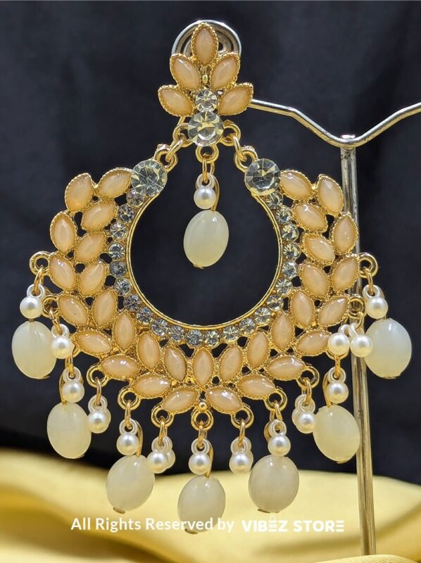 Pearl Drop Earrings 2 Close-up view of elegant Pearl Drop Earrings with golden detailing and dangling pearl accents.