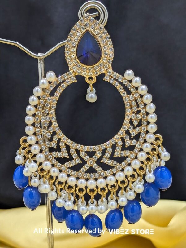 Blue Pearl Hoop Earrings 2 Close-up of Blue Pearl Hoop Earrings with intricate golden detailing and dangling blue pearls.