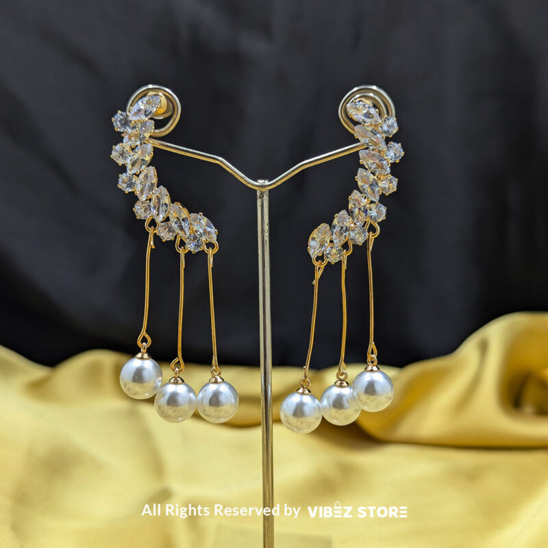 Elegant Pearl Drop Earrings 1 Close-up of Elegant Pearl Drop Earrings with shimmering crystals and dangling pearls.