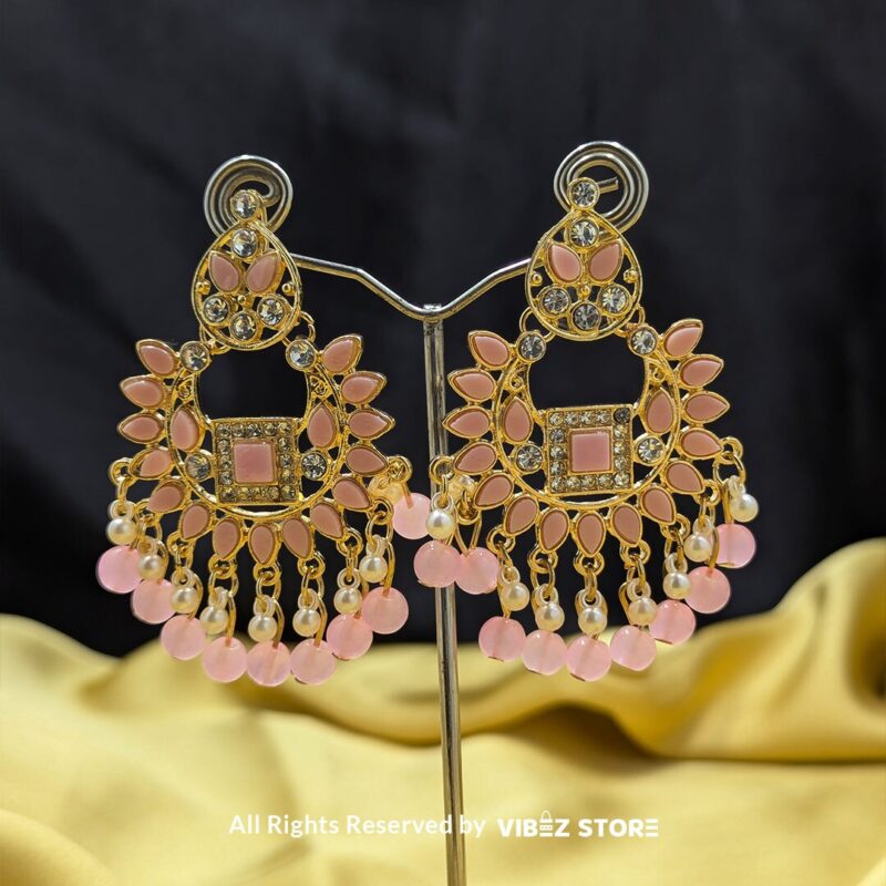 Blush Pearl Statement Earrings 1 Close-up of Blush Pearl Statement Earrings with gold-tone detailing, blush pink gemstones, and pearl drops.