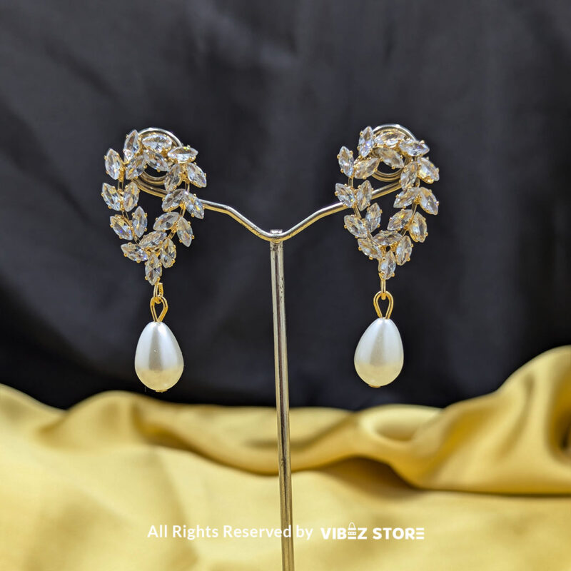 Crystal Leaf and Pearl Drop Earrings 2 Crystal leaf earrings with teardrop pearl detailing, ideal for weddings and special occasions.