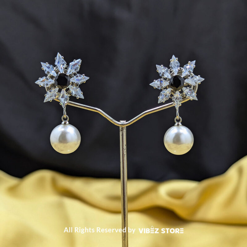Snowflake Pearl Drop Earrings 2 Snowflake-inspired earrings with a pearl drop, featuring sparkling crystals, ideal for festive and formal wear.
