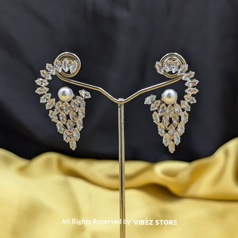 Crystal Cascade Pearl Earrings 1 Cascading crystal earrings with a luminous pearl accent, ideal for weddings and glamorous occasions.