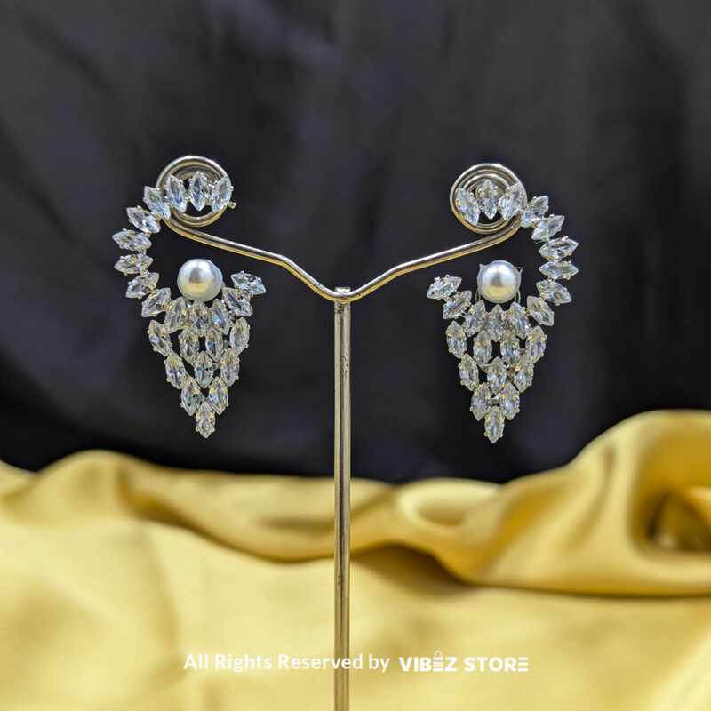 Crystal Cascade Pearl Earrings 2 Cascading crystal earrings with a luminous pearl accent, ideal for weddings and glamorous occasions.