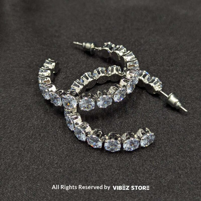 Crystal Studded Hoop Earrings 1 Shimmering crystal studded hoop earrings in a sleek design, perfect for elegant occasions.