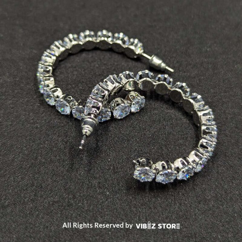 Crystal Studded Hoop Earrings 3 Shimmering crystal studded hoop earrings in a sleek design, perfect for elegant occasions.