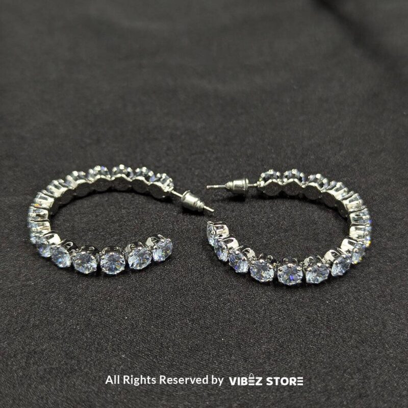 Crystal Studded Hoop Earrings 2 Shimmering crystal studded hoop earrings in a sleek design, perfect for elegant occasions.