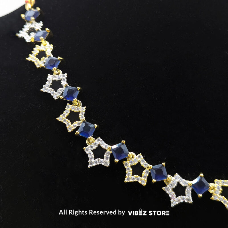 Midnight Sapphire Star Necklace 4 Midnight Sapphire Star Necklace and Earring Set with gold-tone star designs, faux sapphire stones, and crystal accents from VibezStore