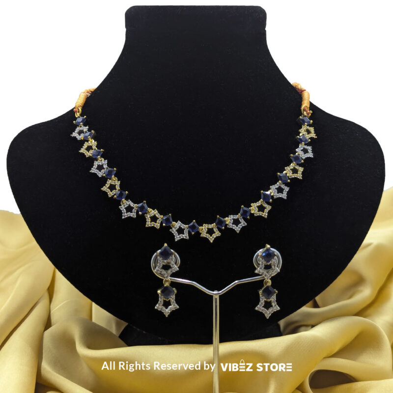 Midnight Sapphire Star Necklace 1 Midnight Sapphire Star Necklace and Earring Set with gold-tone star designs, faux sapphire stones, and crystal accents from VibezStore